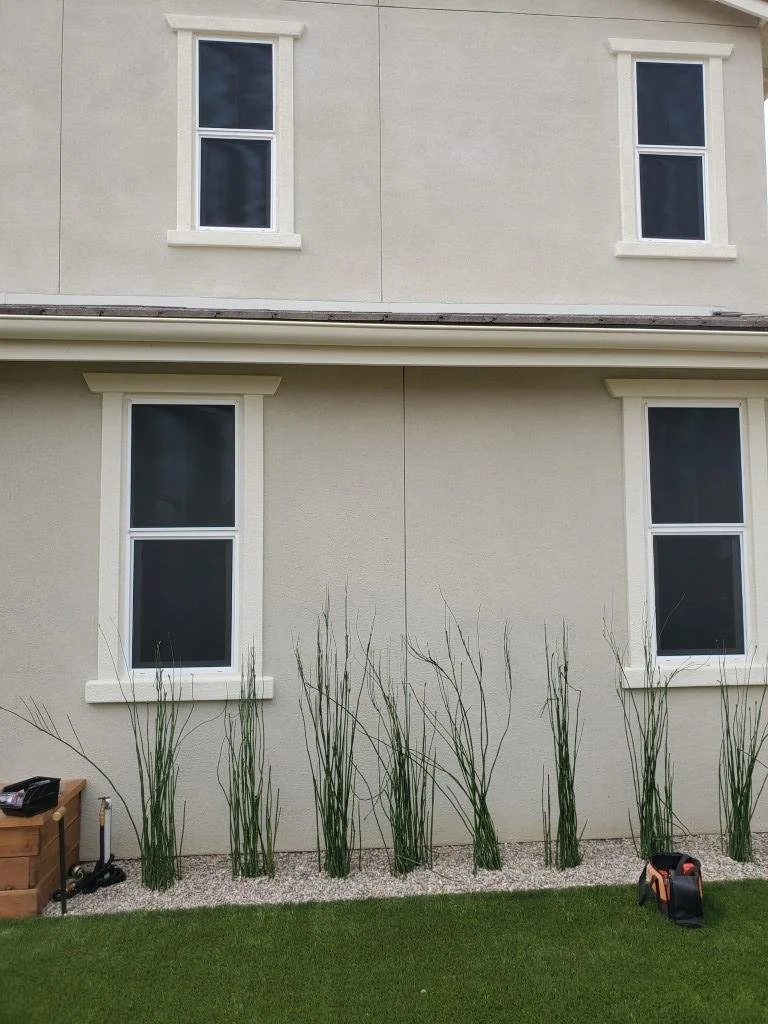 Custom window screens on a home exterior